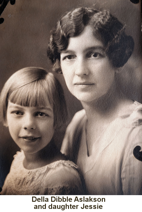 Sepia-tone photo of a young woman with dark flat curls and a shallow V-neck dress with a young girl with short blond straight hair and bangs